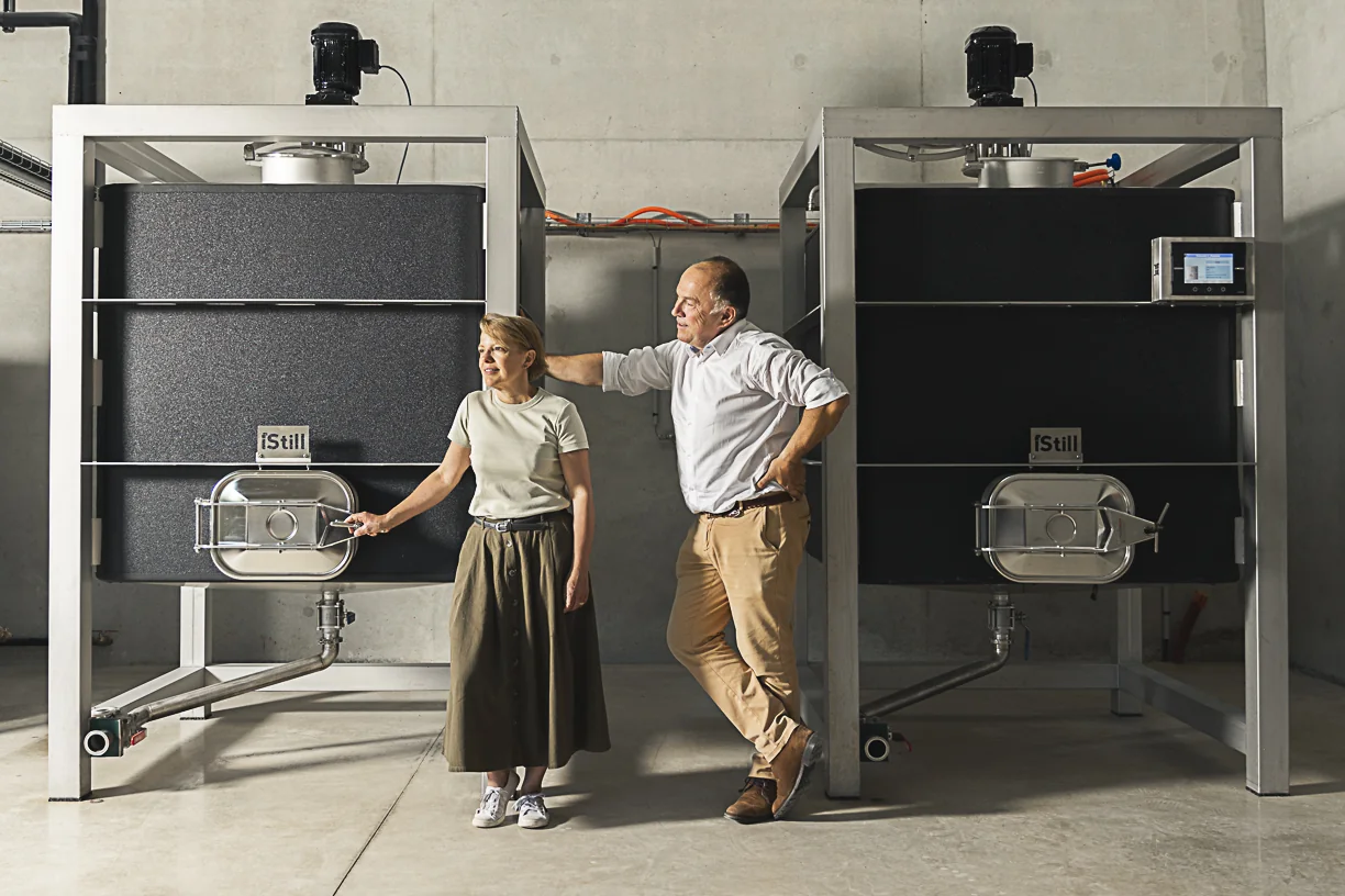 Vincent and Véronique Godier beside their iStill production equipment at Distillerie de Soligny.